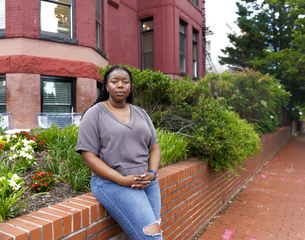 Cornelia Poku poses in Washington DC after mass layoffs in the federal government.